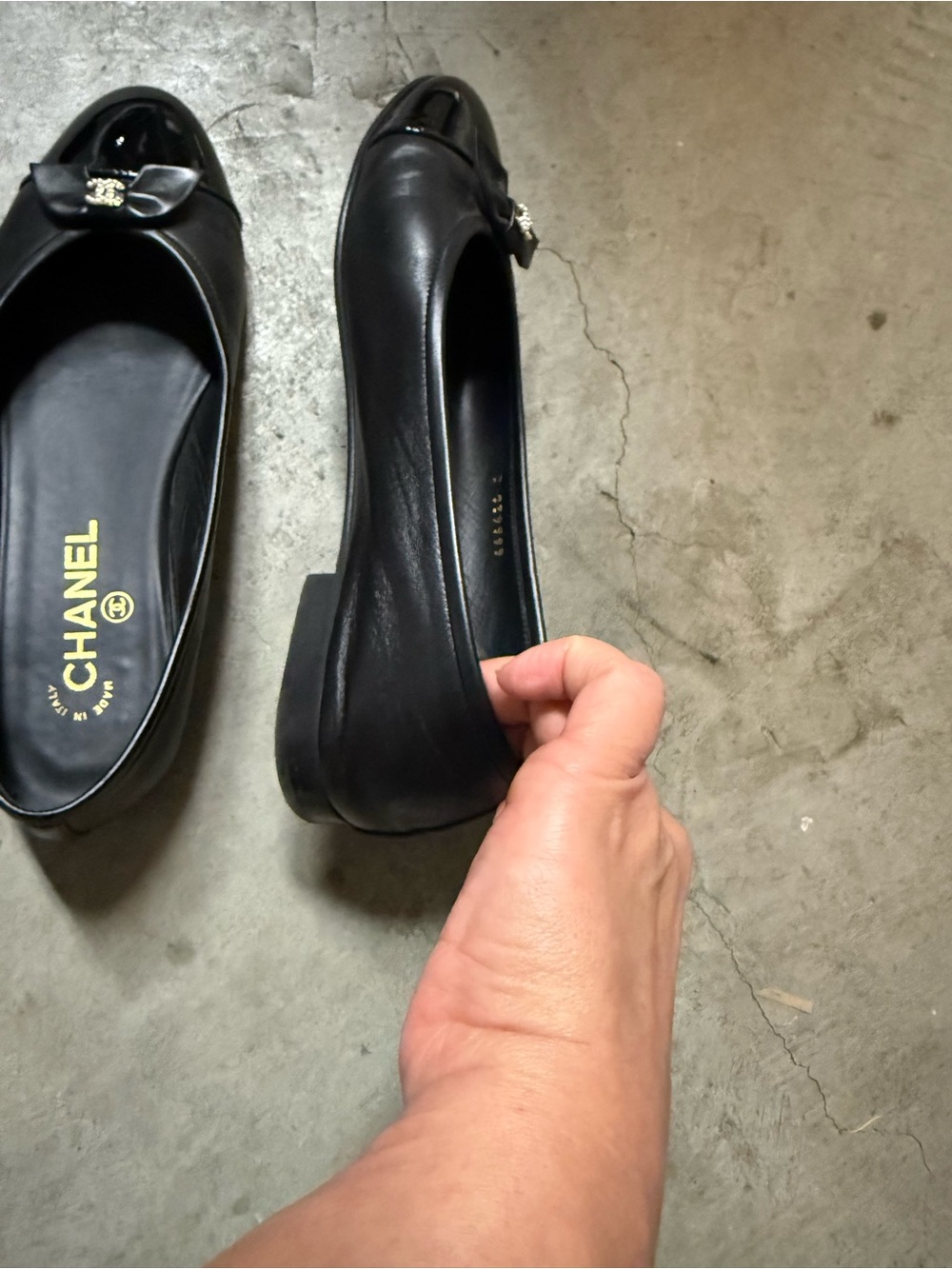 CHANEL Black Leather Ballet Flats with Patent Cap Toe and CC Charm - Picture 7 of 9